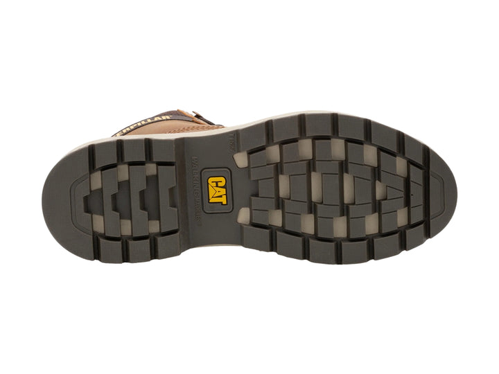 Zapato botín Caterpillar de cuero color tan con suela gruesa y detalles amarillos.