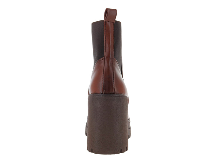 Botín Luna Rosa color tan con tacón grueso y suela dentada en marrón oscuro.