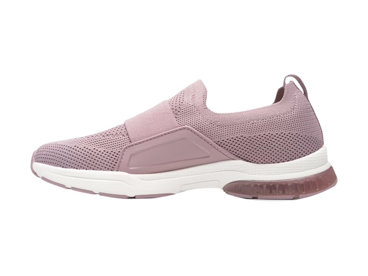 Tenis Flexi color morado taro, estilo slip-on con suela blanca y tejido textil.