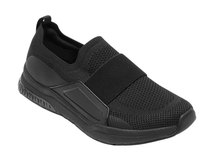 Zapato plano Flexi color negro, estilo slip-on con tejido textil y suela cómoda.