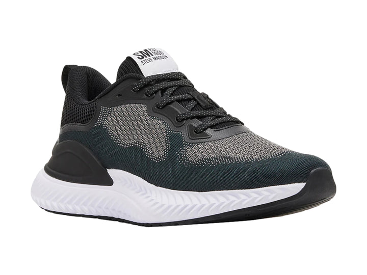 Tenis Steve Madden modelo Slater en color negro y gris con suela blanca gruesa.