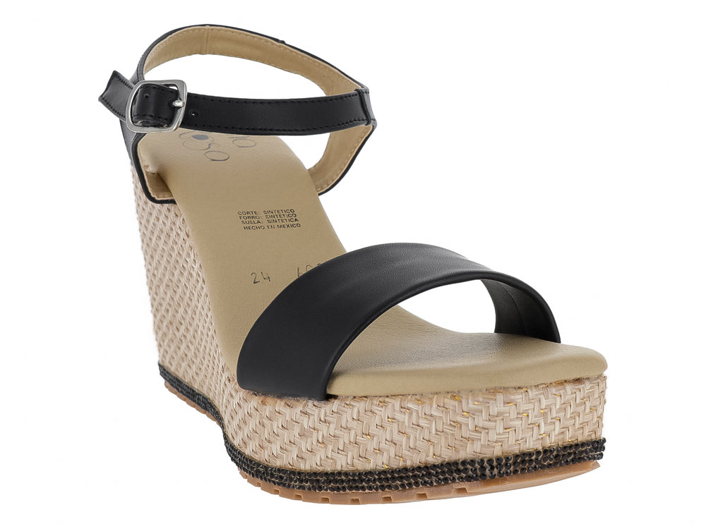 Sandalia de cuña con tiras negras y plataforma de tejido beige.