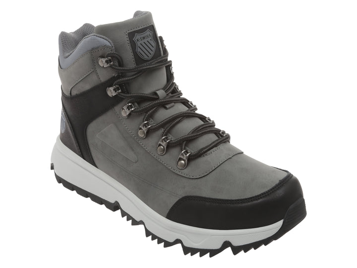 Bota K-Swiss color gris y negro con suela blanca y cordones.