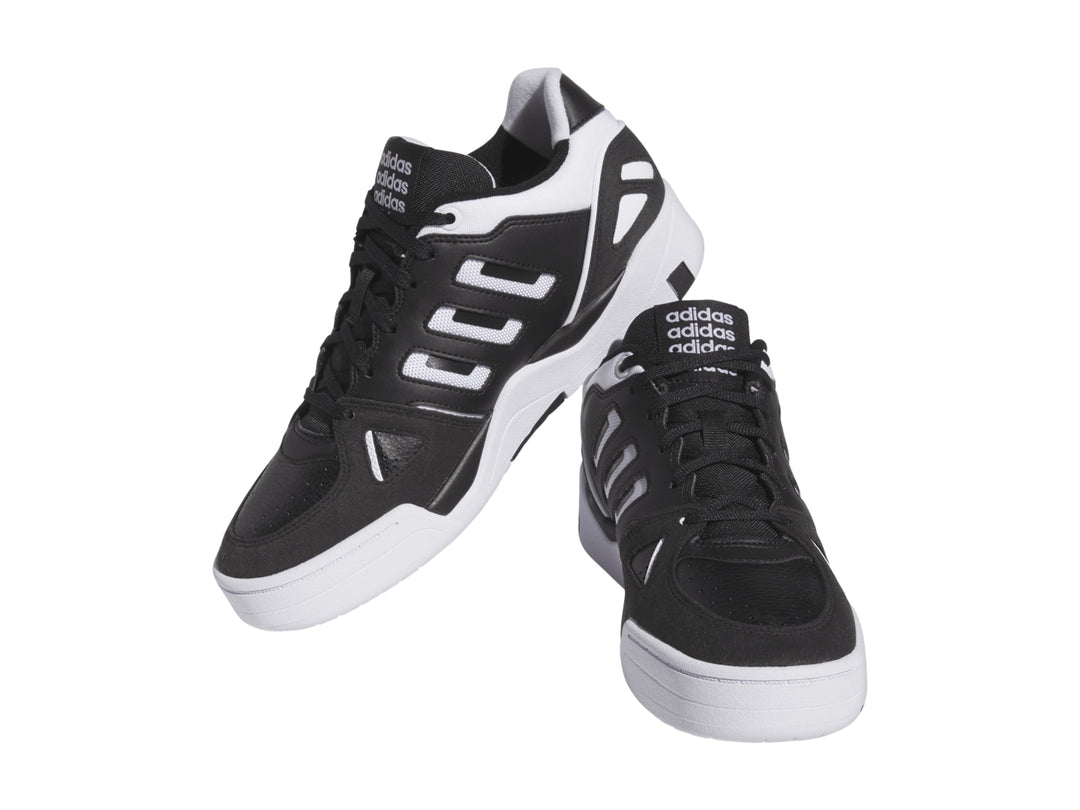 Tenis Adidas Midcity Low en color negro con detalles y suela blanca.