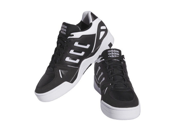 Tenis Adidas Midcity Low en color negro con detalles y suela blanca.