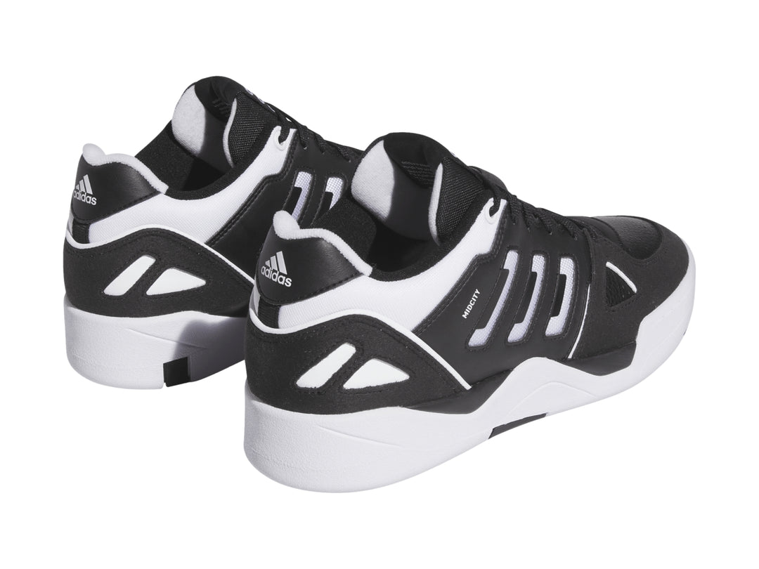 Tenis Adidas Midcity Low en color negro con detalles y suela blanca.