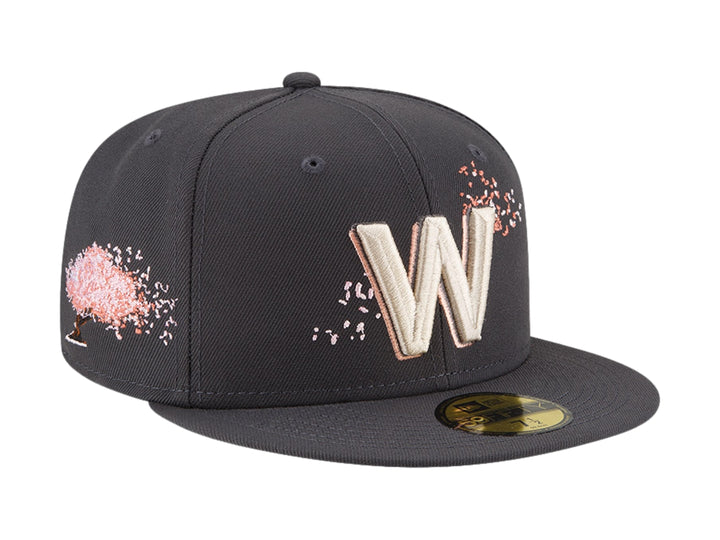 Gorra New Era color navy con visera plana y letra W bordada en blanco en el frente.