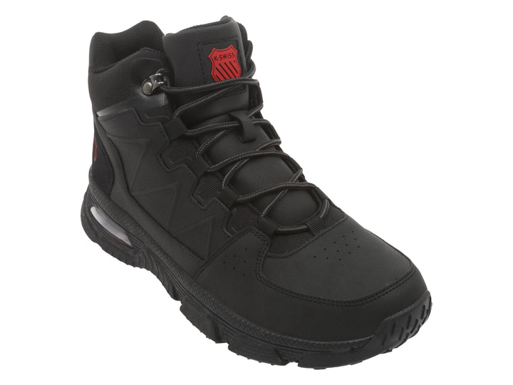 Bota K-SWISS color negro con suela robusta y cámara de aire visible en el talón.