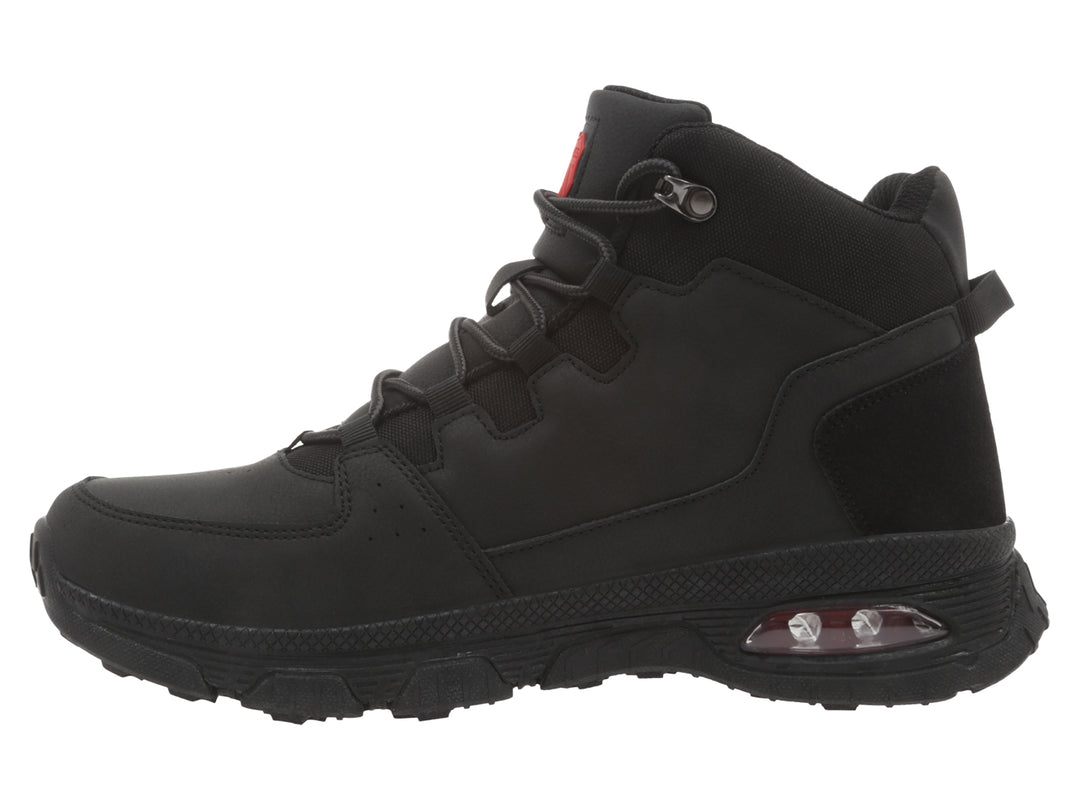 Bota K-SWISS color negro con suela robusta y cámara de aire visible en el talón.