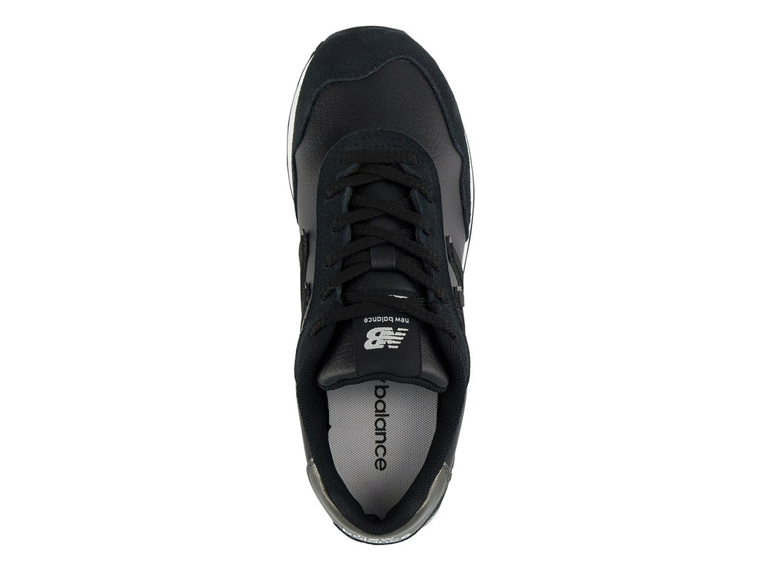 Tenis New Balance 515 color negro con suela blanca y detalles en gris en el talón.