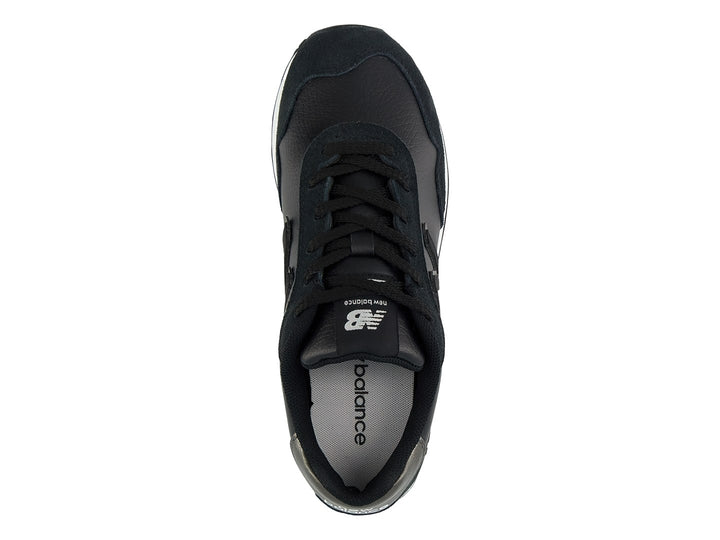 Tenis New Balance 515 color negro con suela blanca y detalles en gris en el talón.