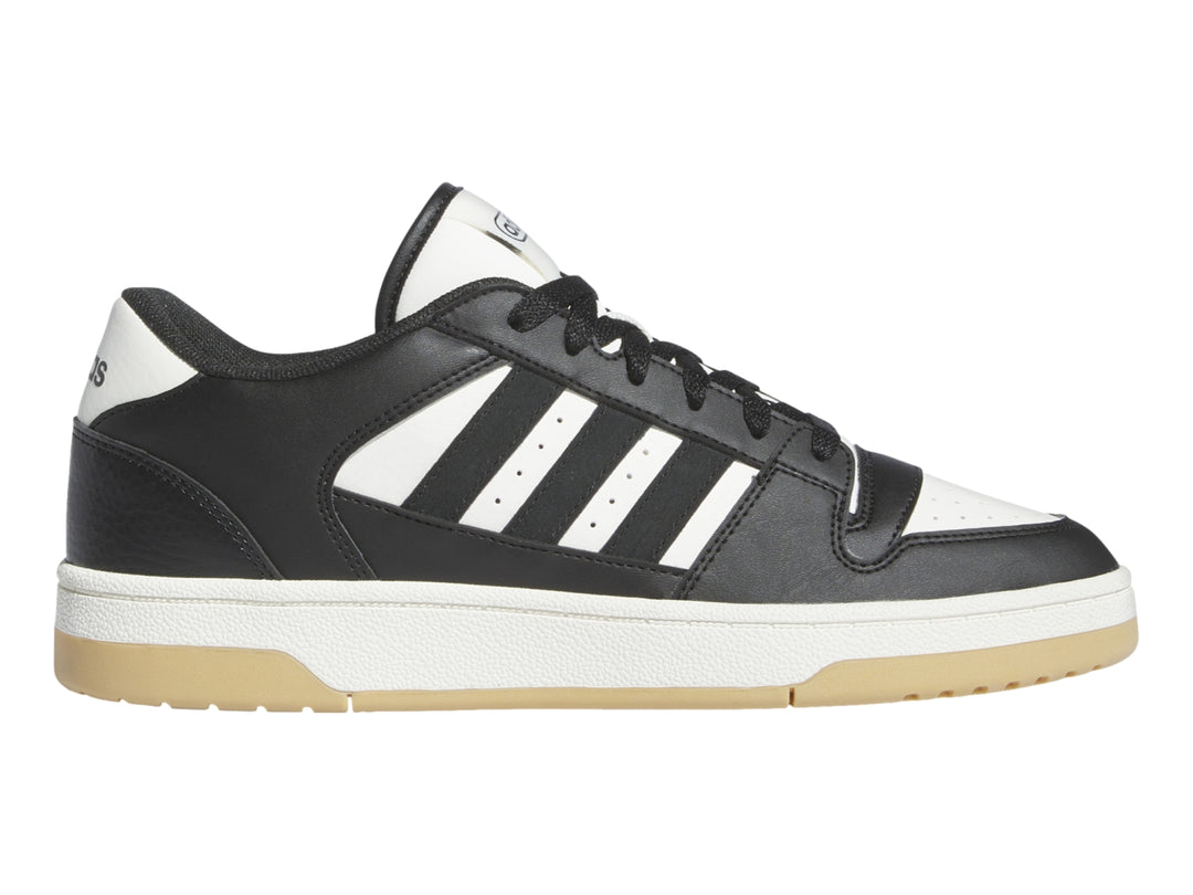 Tenis Adidas Break Start en color negro con franjas blancas y suela beige.
