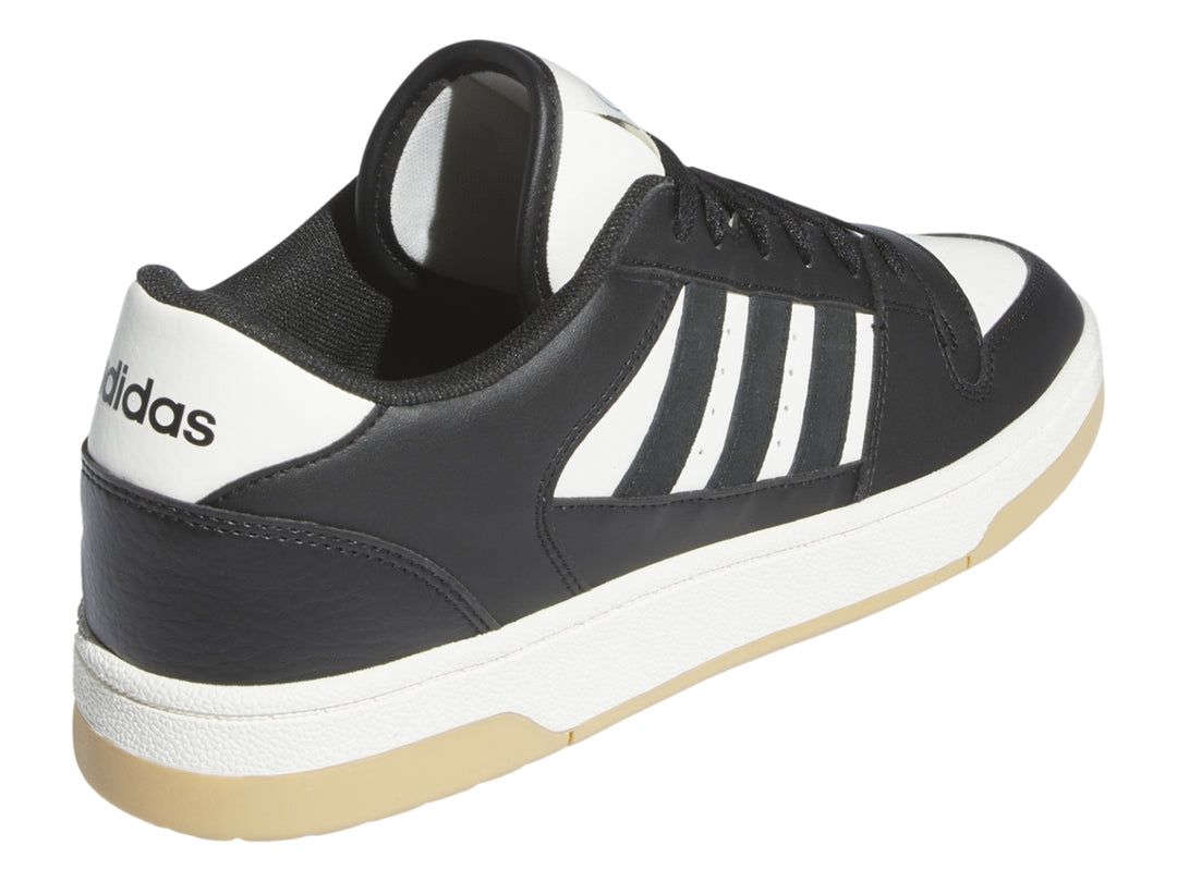 Tenis Adidas Break Start en color negro con franjas blancas y suela beige.