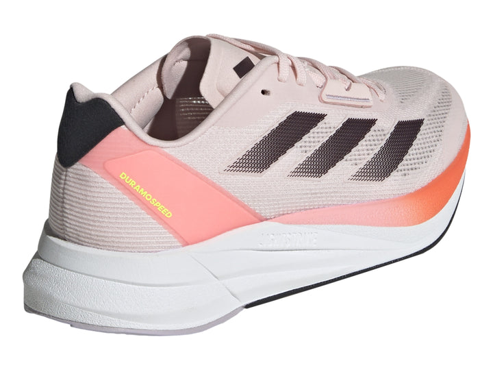 Tenis deportivos Adidas color rosa con franjas grises, detalles naranjas y suela blanca.