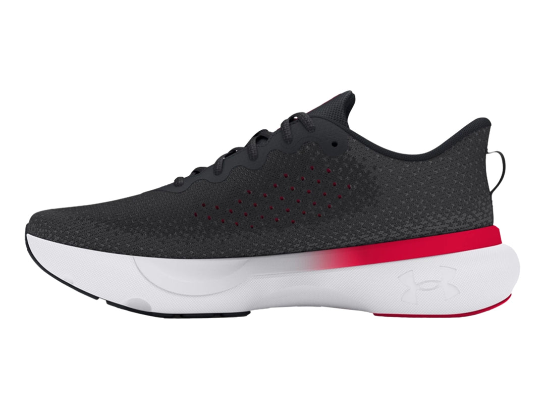 Tenis deportivos Under Armour color negro con suela blanca y detalles en rojo.