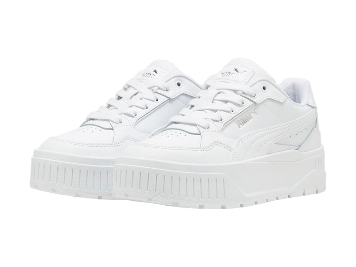 Tenis PUMA blancos modelo Carmen II Idol con suela de plataforma gruesa y detalles en plata.