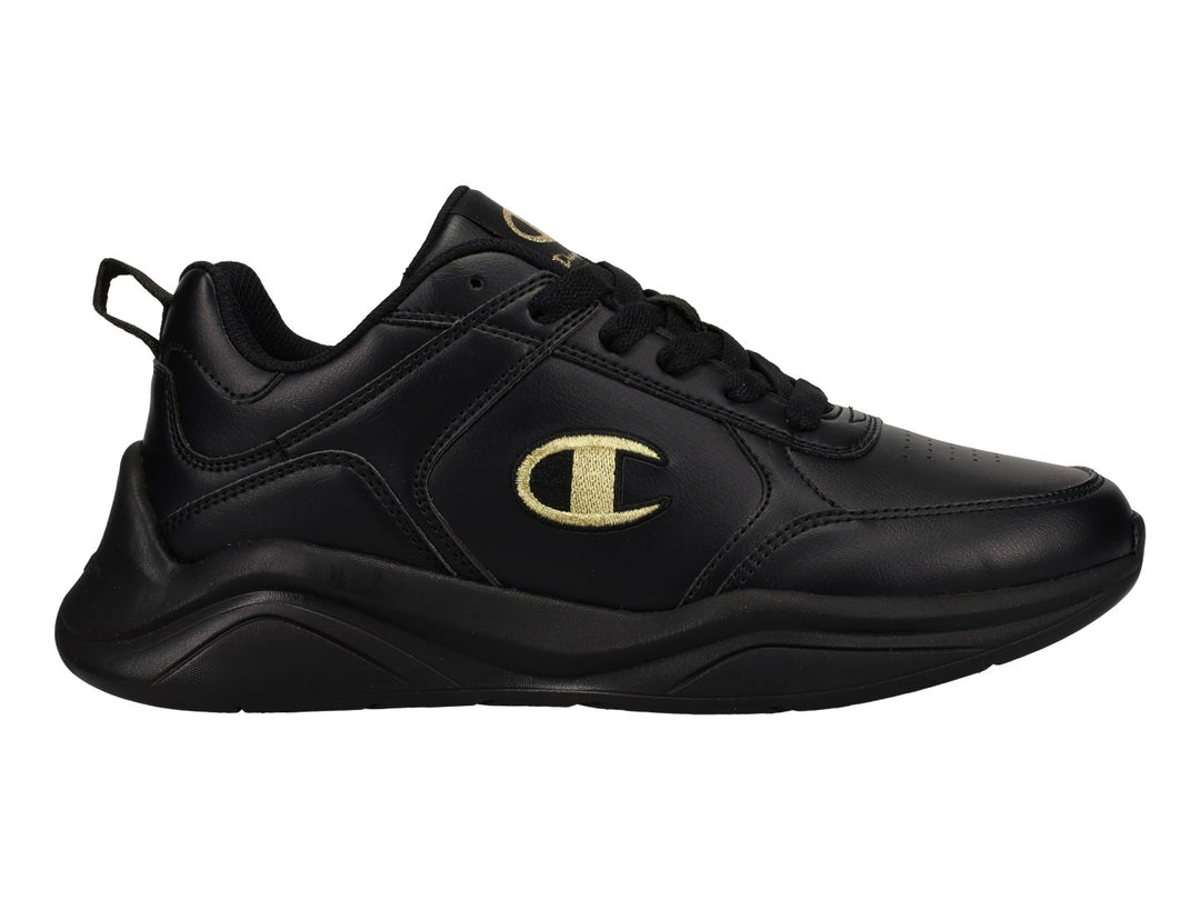 Tenis deportivos Champion color negro con logotipo dorado en el lateral y suela negra.