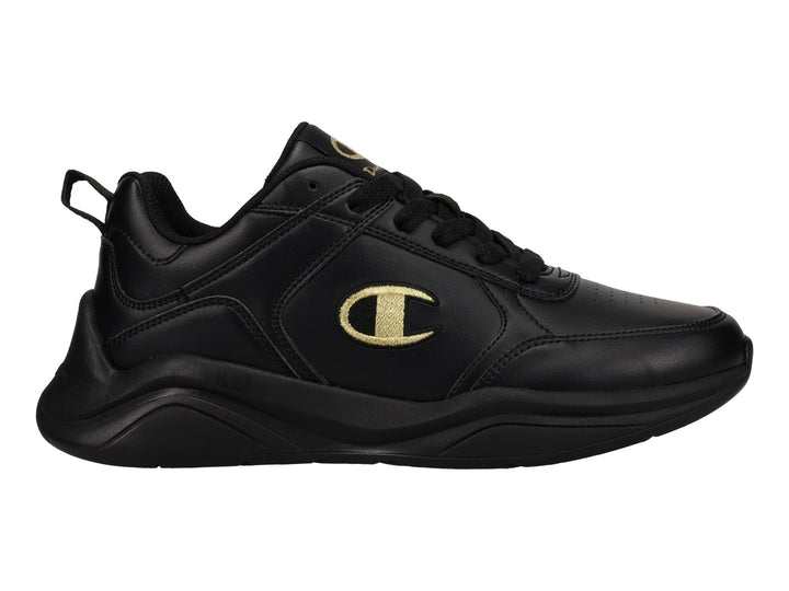 Tenis deportivos Champion color negro con logotipo dorado en el lateral y suela negra.