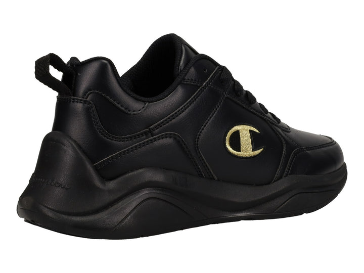 Tenis deportivos Champion color negro con logotipo dorado en el lateral y suela negra.