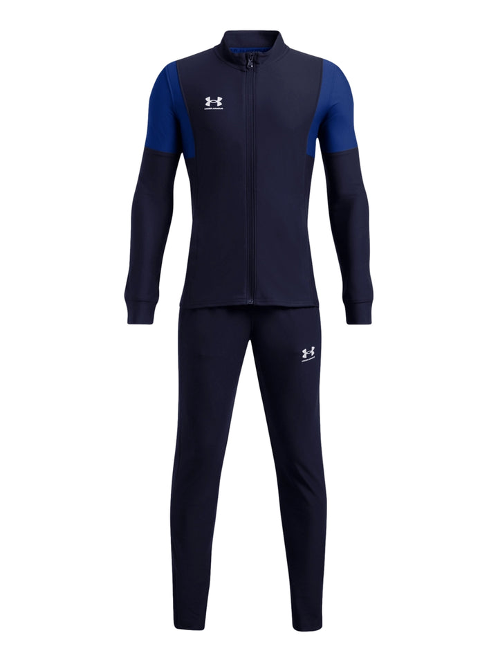 Conjunto deportivo Under Armour para niño en color azul marino con detalles en azul real, incluye chaqueta y pantalón.