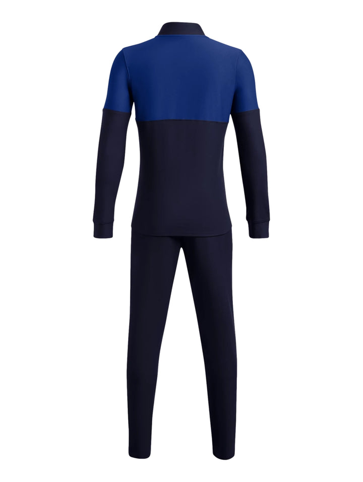 Conjunto deportivo Under Armour para niño en color azul marino con detalles en azul real, incluye chaqueta y pantalón.