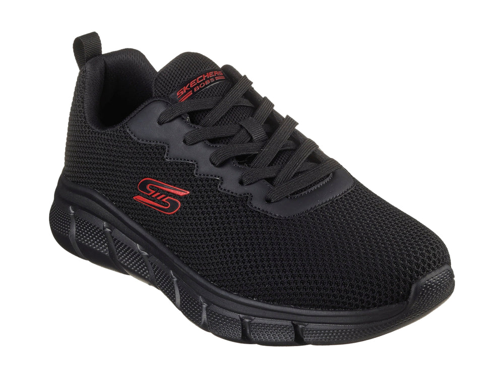 Tenis deportivos Skechers color negro con suela gruesa y detalles en rojo.