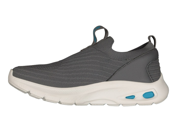 Tenis Skechers color gris con suela blanca y detalles en azul claro, estilo slip-on sin cordones.