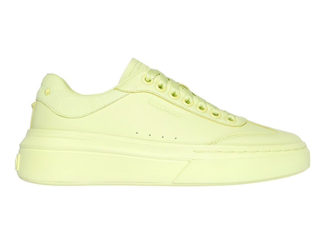 Tenis Skechers color lima monocromático con suela de plataforma y cordones.