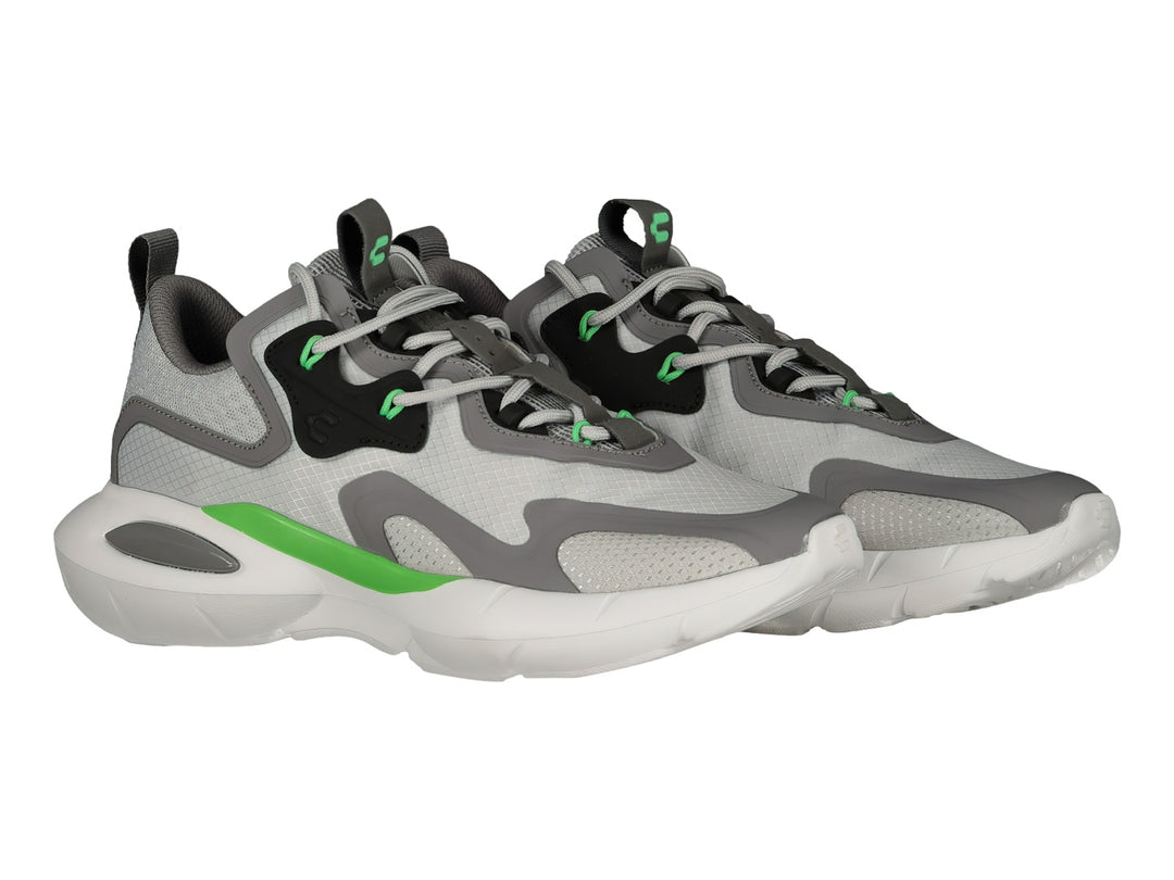 Tenis deportivos Charly en color gris con detalles en negro, blanco y verde lima, con suela blanca robusta.