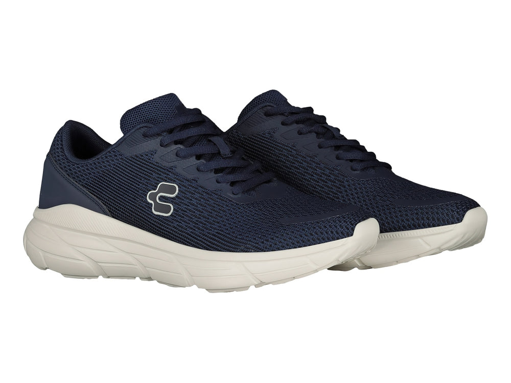 Tenis deportivos Charly en color marino con suela blanca y logotipo lateral blanco.