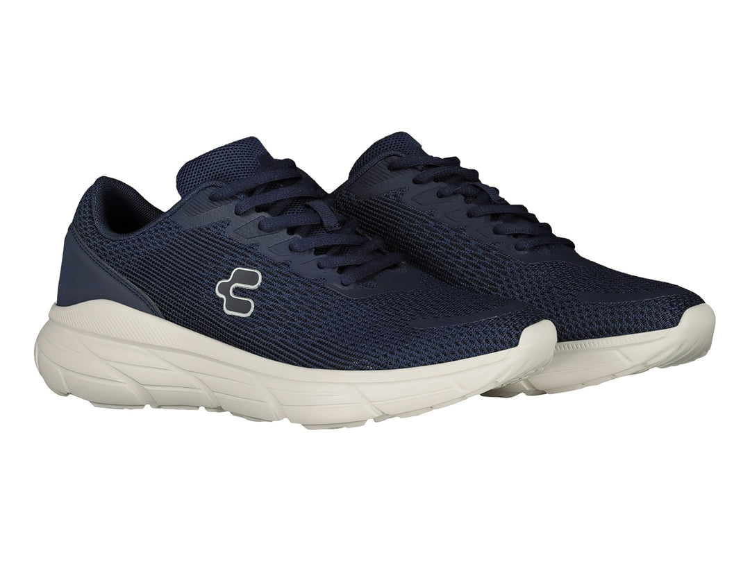 Tenis deportivos Charly en color marino con suela blanca y logotipo lateral blanco.