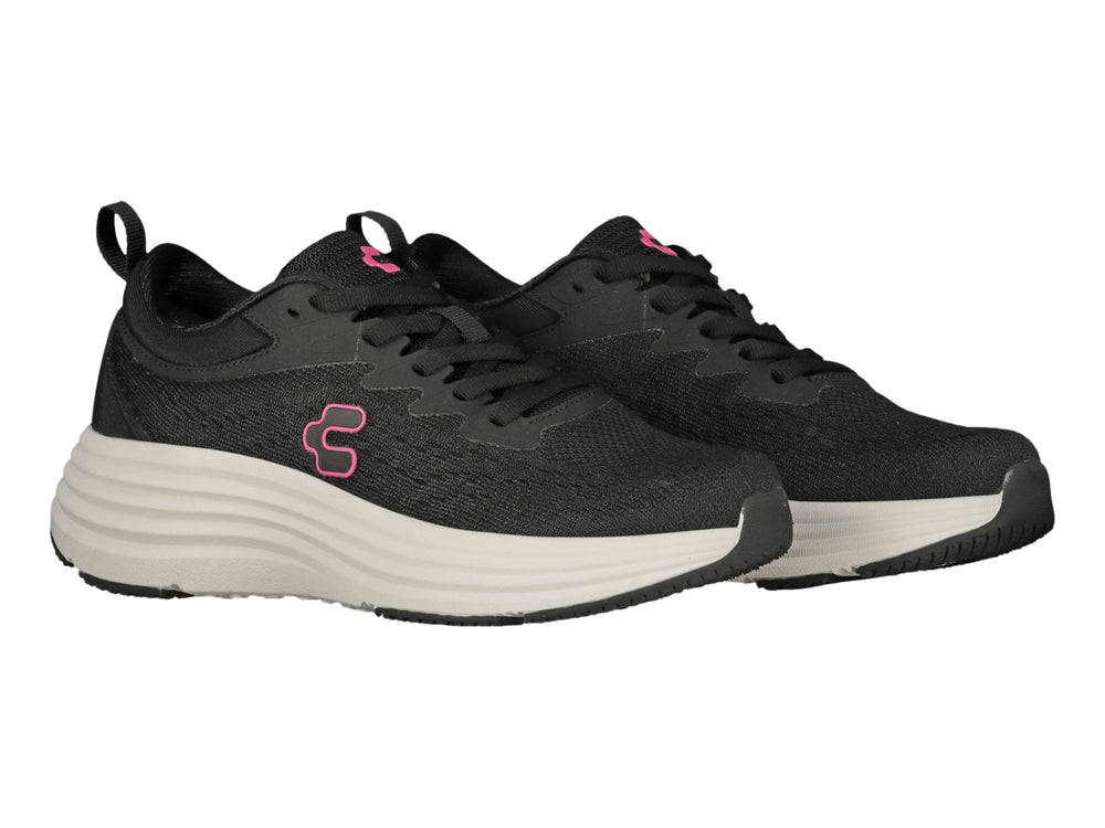 Tenis deportivos Charly color negro con suela blanca y logotipo rosa en el costado.