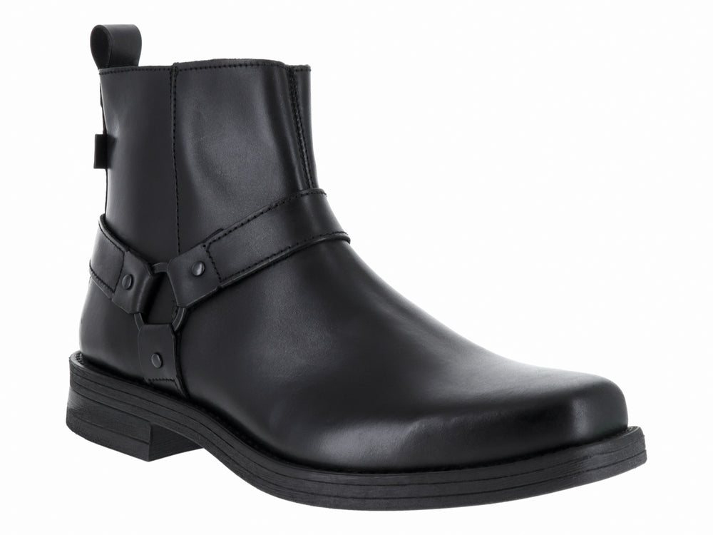 Bota negra de material sintético con correa y aro decorativo en el tobillo.