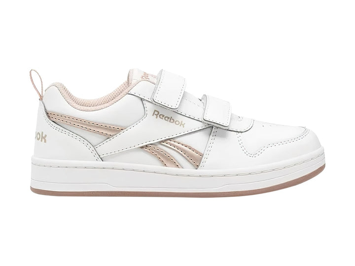 Tenis blancos Reebok con cierres de velcro y detalles en color dorado.