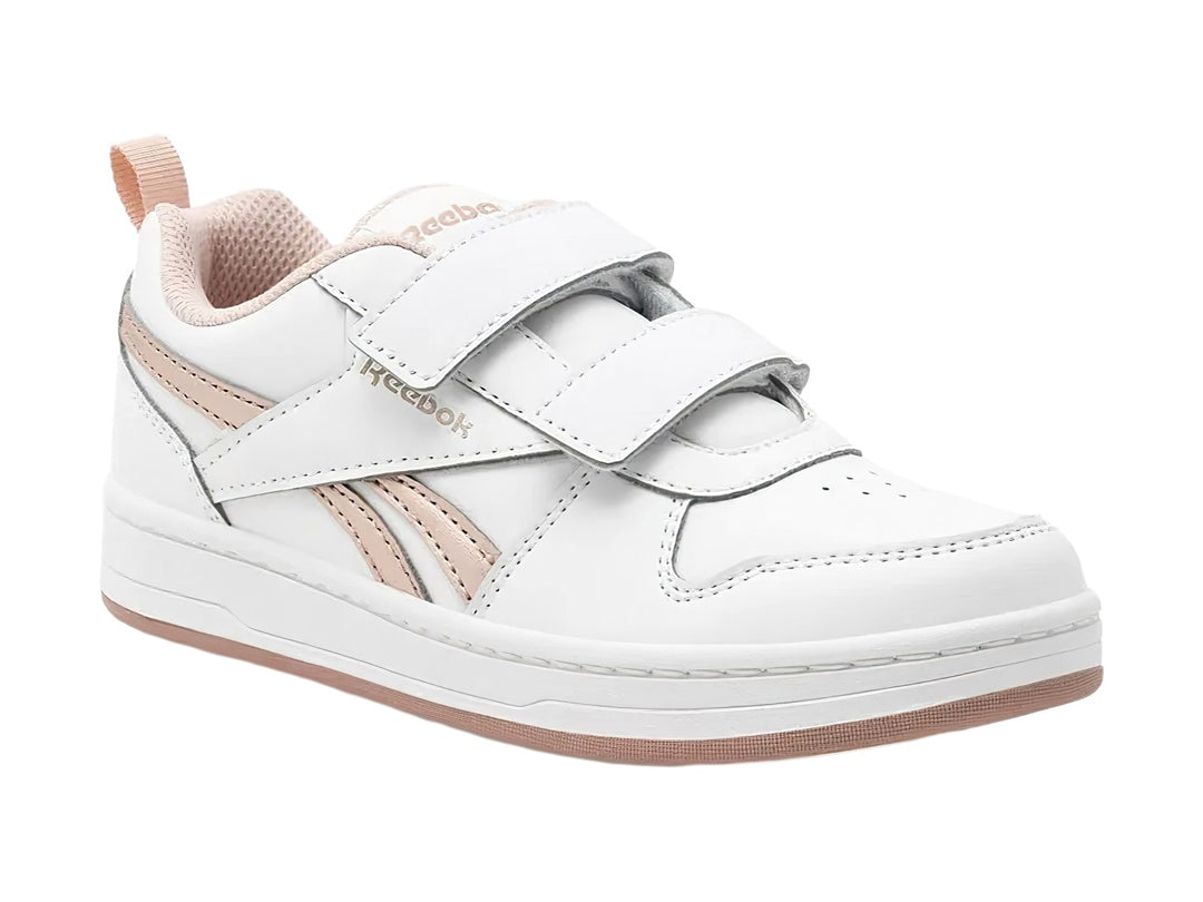 Tenis blancos Reebok con cierres de velcro y detalles en color dorado.