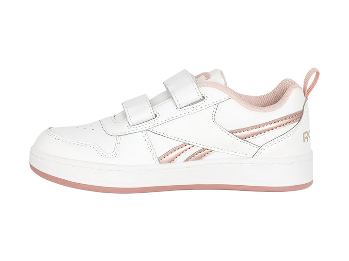 Tenis blancos Reebok con cierres de velcro y detalles en color dorado.