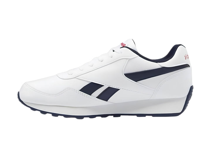 Tenis deportivos Reebok blancos con detalles en azul marino y rojo para niños.