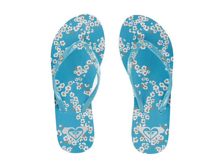 Sandalias tipo flip-flop color turquesa con tira estampada y detalle de línea blanca en la suela.