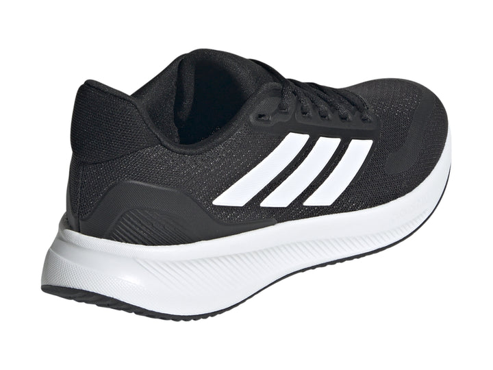 Tenis deportivos Adidas Runfalcon 5 para niños en color negro con franjas y suela blanca.