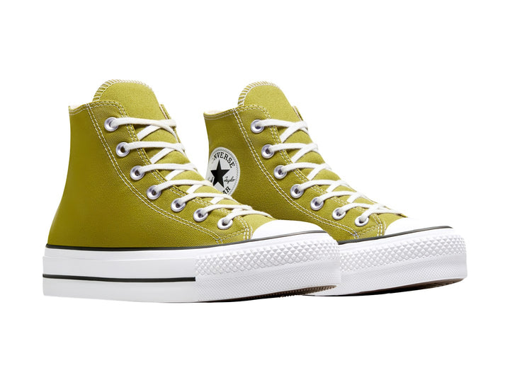 Tenis Converse de bota color verde oliva con suela de plataforma blanca y cordones blancos.