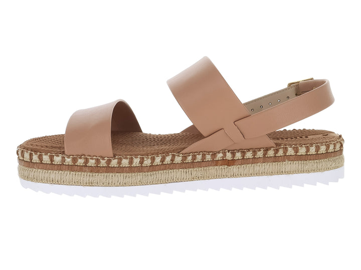 Sandalias Moleca color nude con plataforma de esparto y correa ajustable con hebilla dorada.
