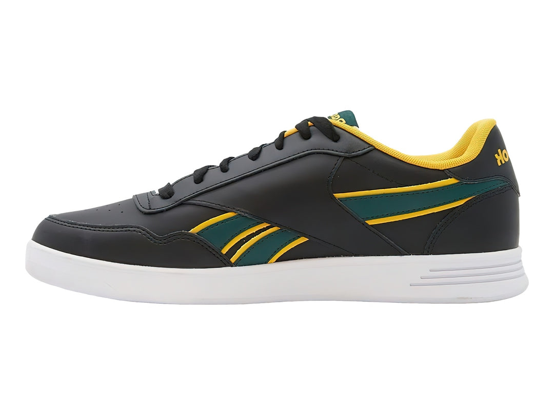 Tenis deportivos Reebok color negro con detalles en amarillo y verde y suela blanca.