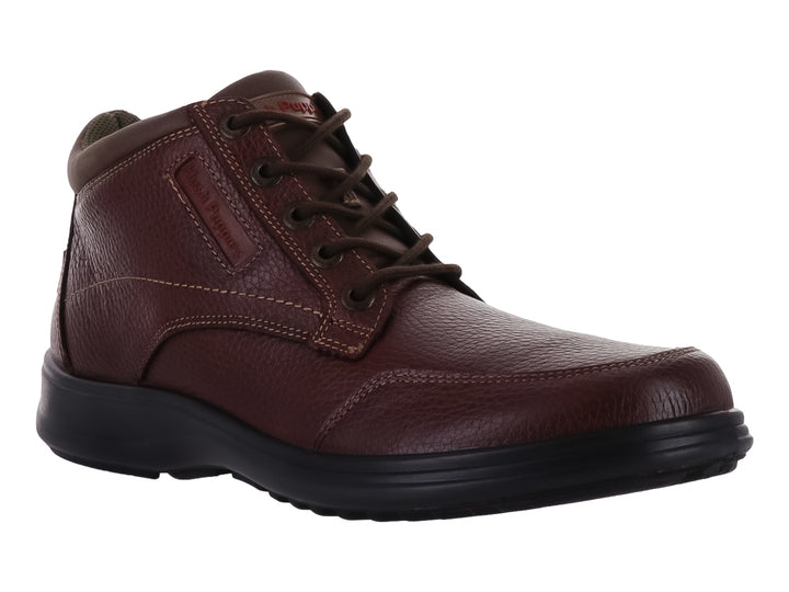 Zapato botín Hush Puppies de cuero color cogñac con suela negra y agujetas.