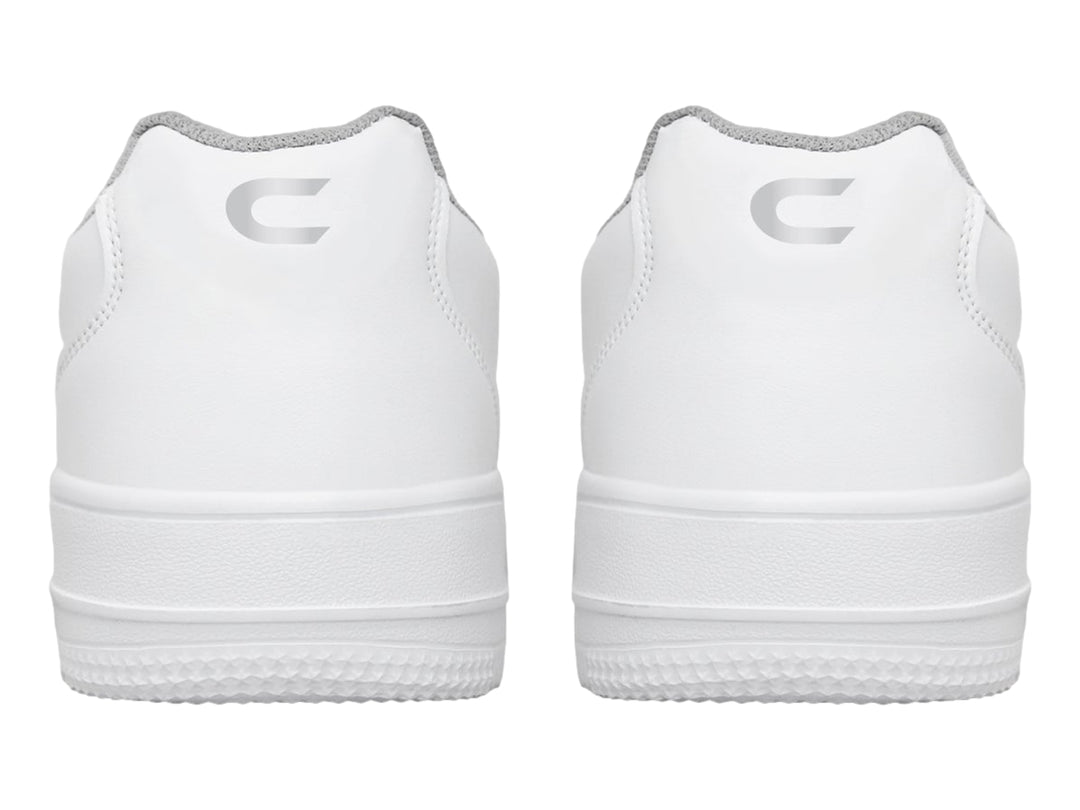 Tenis deportivos blancos con cierre de velcro y suela blanca.