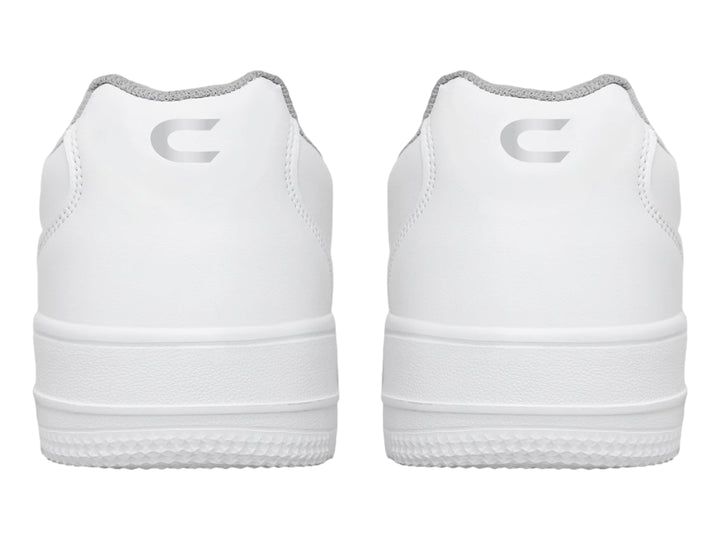 Tenis deportivos blancos con cierre de velcro y suela blanca.