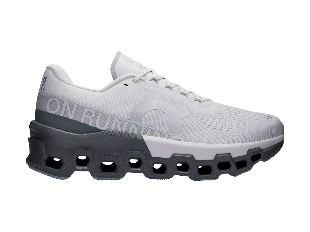 Tenis deportivos ON Cloudmonster 2 color Frost Rock con suela gris oscuro y malla gris claro.