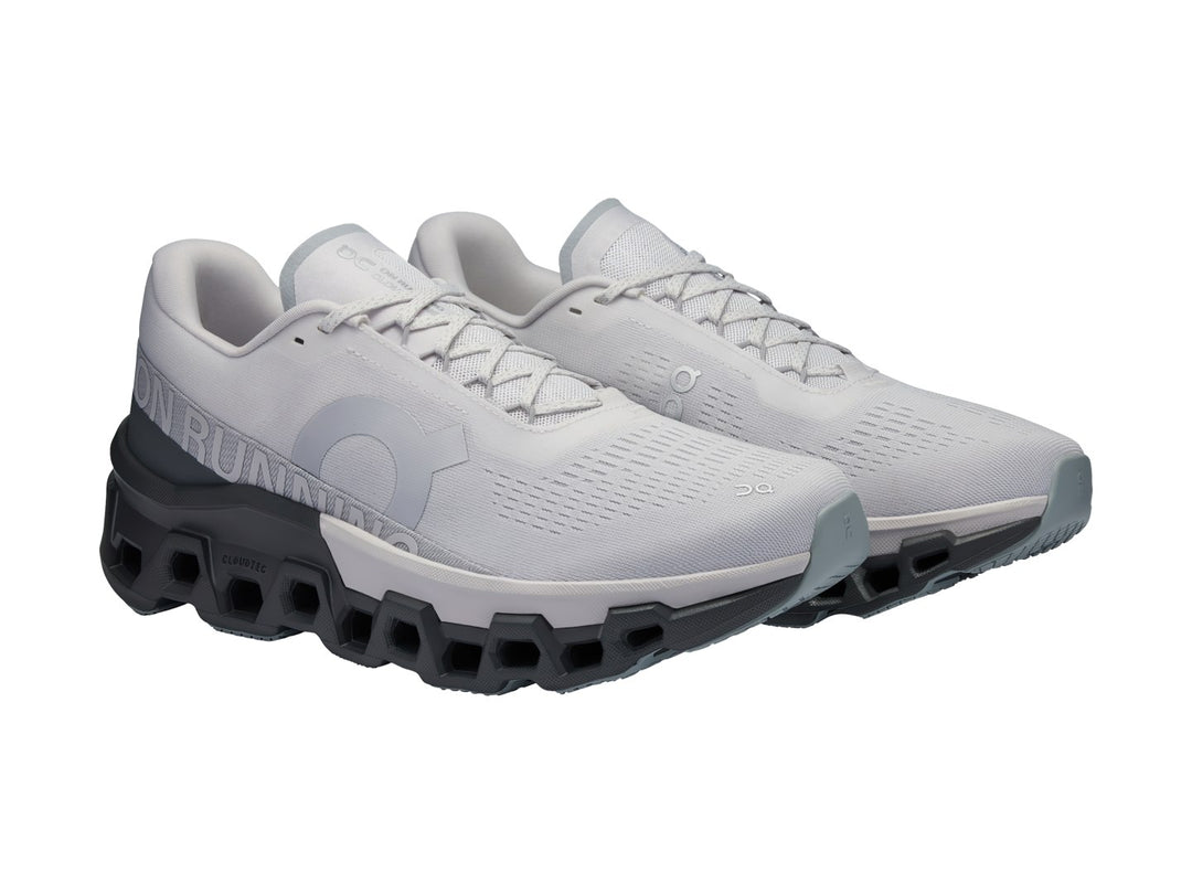 Tenis deportivos ON Cloudmonster 2 color Frost Rock con suela gris oscuro y malla gris claro.