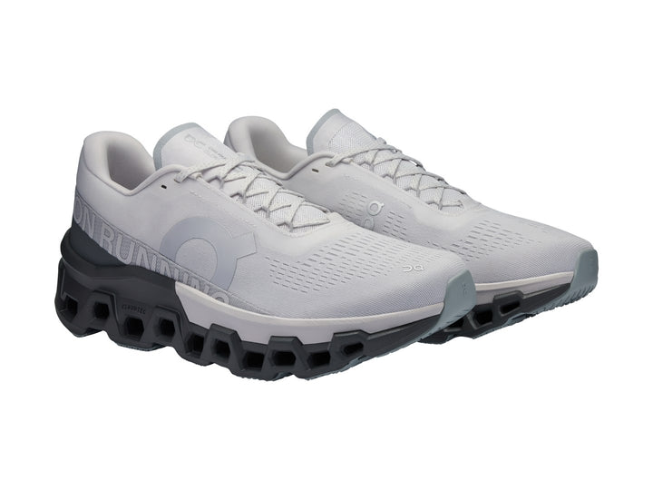 Tenis deportivos ON Cloudmonster 2 color Frost Rock con suela gris oscuro y malla gris claro.