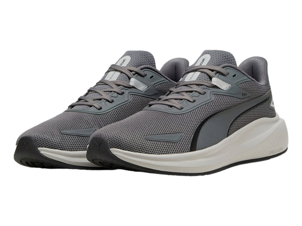 Tenis deportivos PUMA Skyrocket Lite en color gris oscuro y gris claro con suela blanca.