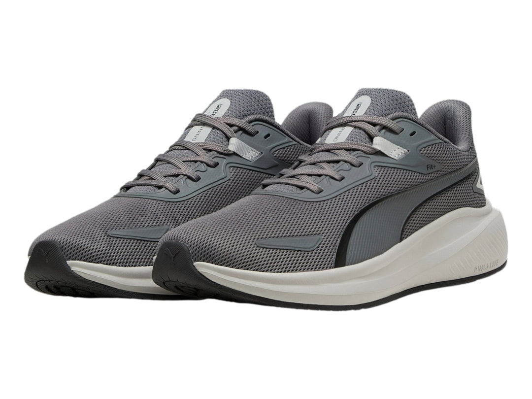 Tenis deportivos PUMA Skyrocket Lite en color gris oscuro y gris claro con suela blanca.